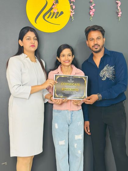 A happy student receiving her certificate at the Rajasthan workshop.