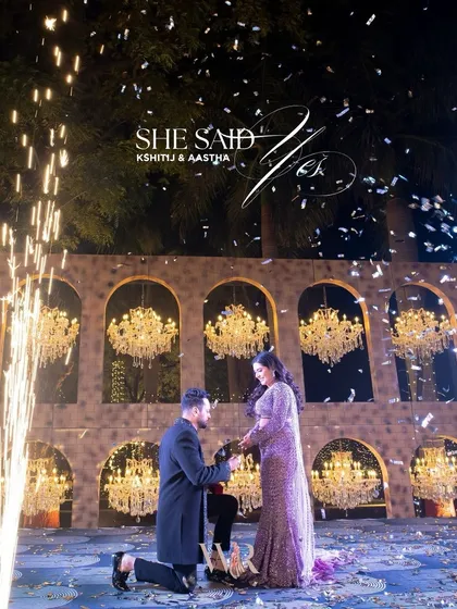 The perfect proposal deserves a stage that speaks of forever. We set this moment against a grand arched backdrop filled with sparkling chandeliers, with fireworks illuminating the sky as she said yes. It’s about creating a core memory, not just a moment.