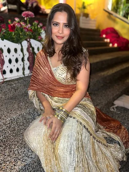 A candid moment from the Qawwali night. This look was all about shimmer and comfort, perfect for a night of music and celebration.