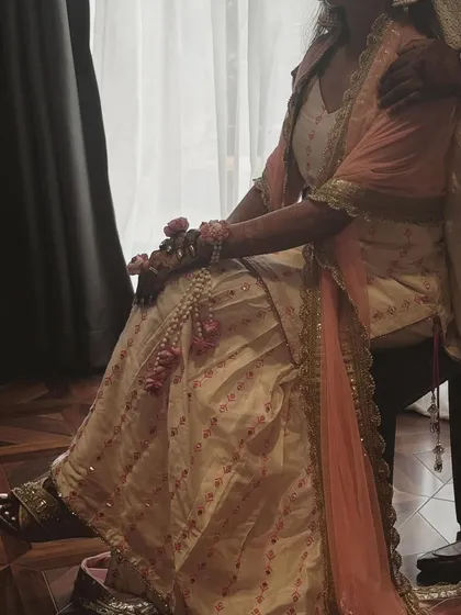 A candid moment captured during a fitting. This is where the vision starts to come to life, ensuring the outfit is not just beautiful but also comfortable and a true reflection of the bride's personality.