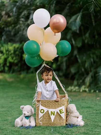 A fun "hot air balloon" prop shot from an outdoor first birthday session. I love getting creative with props to make the shoot memorable.