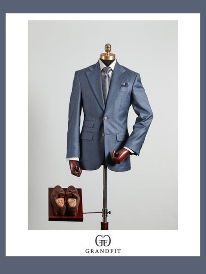 A beautifully crafted light blue suit, demonstrating a softer approach to formalwear. The subtle sheen of the fabric makes it ideal for special occasions.