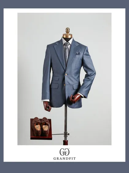 A beautifully crafted light blue suit, demonstrating a softer approach to formalwear. The subtle sheen of the fabric makes it ideal for special occasions.