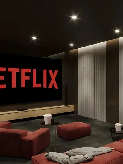 A minimalist home theater setup perfect for a modern home. The design features a large screen, a simple media console, and comfortable, modular seating for a relaxed movie night.