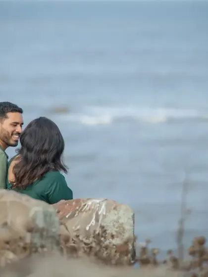 A sweet, stolen moment during a pre-wedding session. The composition focuses on their interaction, making the viewer feel like they are sharing a private joke with the couple.