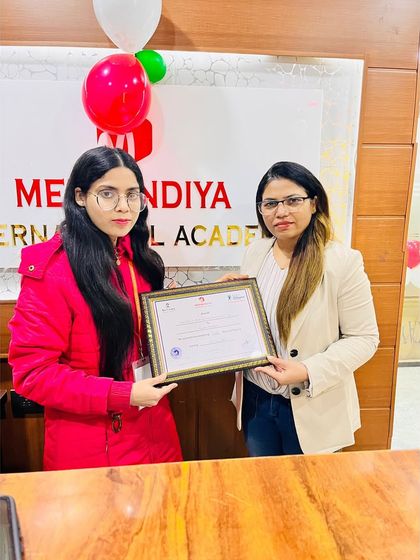 A proud moment captured. Our director personally congratulates each student on their achievement.