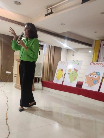 Here I am demonstrating a playful learning technique to a large group of teachers in Hyderabad. I use simple props and storytelling to show how to capture children's attention and make learning concepts memorable and fun.
