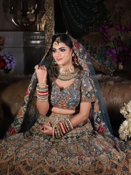 A full portrait of the bride, surrounded by flowers, looking like a queen in her castle.