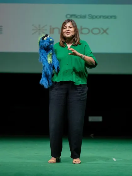 Sharing the stage with my puppet during a motivational talk. This combination of speaking and entertainment is what makes my sessions stand out at corporate functions and offsites.