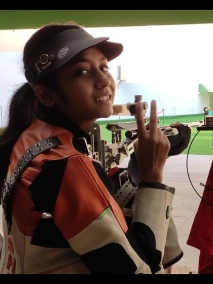 A portrait of our champion shooter, ready for the next challenge. Our athletes are not just trained; they are mentally prepared for success.