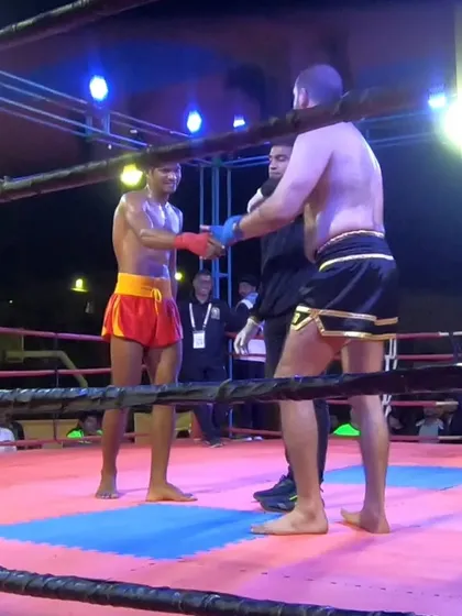 A moment of sportsmanship, shaking hands with the opponent after a hard-fought battle for the title.