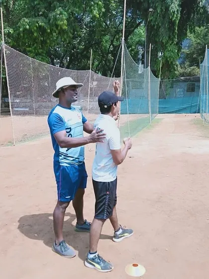 Hands-on guidance for a bowler, ensuring his body is aligned correctly during the delivery stride. This helps prevent injuries and improves accuracy.