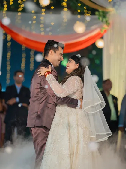 A romantic first dance on a cloud of smoke, this shot from a Catholic wedding reception captures the fairytale moment perfectly.