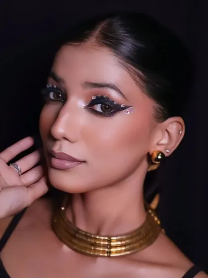 A slightly different angle of the alluring Arabic beauty look, capturing the shimmer of the eye makeup and the glow of the skin.