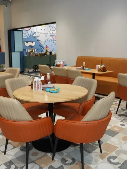 Our versatile dining space can be configured to suit any party size. Here you can see our comfortable booth seating and round tables for adult guests.