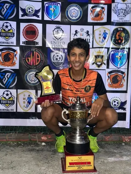Best Player of the tournament. Safwan Duduke with his individual trophy and the team's championship trophy.