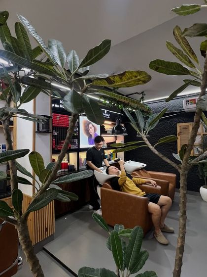 Thinking differently is part of our philosophy. Here, a client enjoys a relaxing hair wash in our modern and green space.