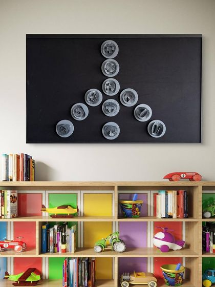 The Peace sign artwork in a child's playroom, a beautiful reminder of harmony and stillness.