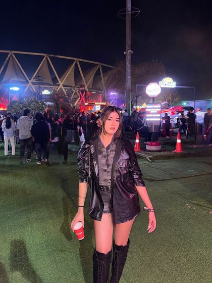 "Confident women don't hate." My concert look for Simba Uproar: denim shorts, a camo top, and a leather jacket.