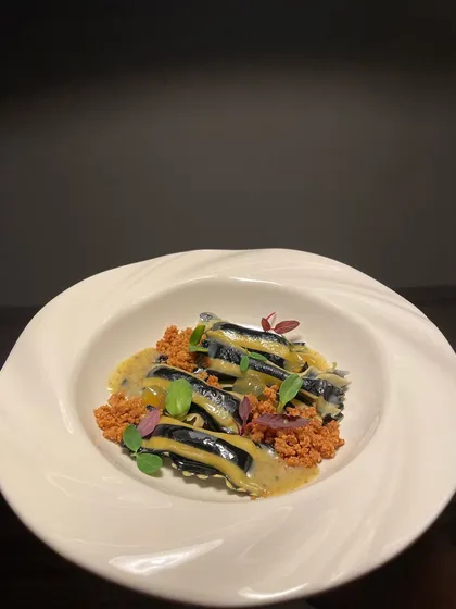 The finished dish: Agnolotti di Patate with a saffron seaweed butter sauce and a sprinkle of malt milk crumble for texture. A signature pasta dish on my tasting menus.