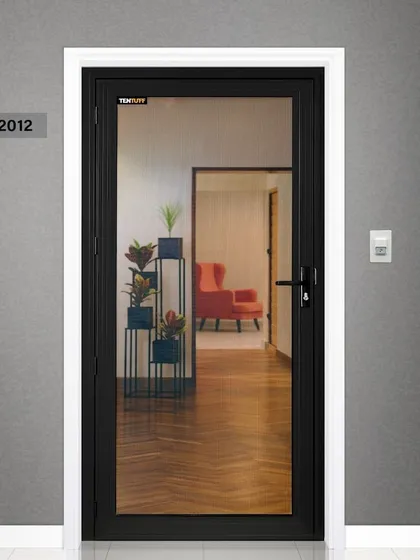 This is our classic hinged security door, model 2012, shown integrated into a modern entryway. The slim black aluminum frame and near-invisible mesh complement the home's interior, proving that robust security can be sleek and unobtrusive.