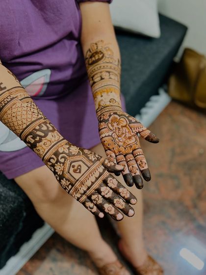 Another angle of the baby Ganesha design, showing the "Mom-to-be" text and other personalized details on the arms.