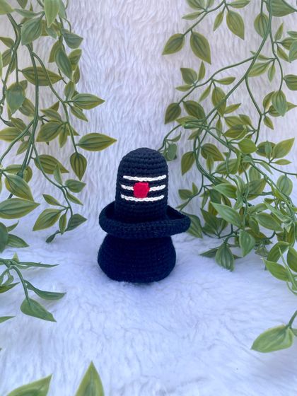 This is the crochet Shivalinga I made as part of a divine set. It is crafted in black yarn with the sacred markings, creating a simple yet powerful spiritual symbol.