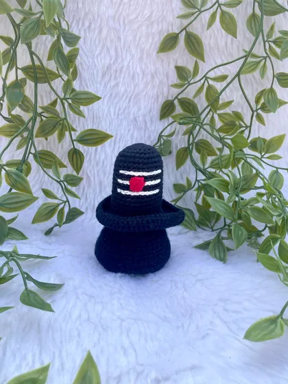 This is the crochet Shivalinga I made as part of a divine set. It is crafted in black yarn with the sacred markings, creating a simple yet powerful spiritual symbol.