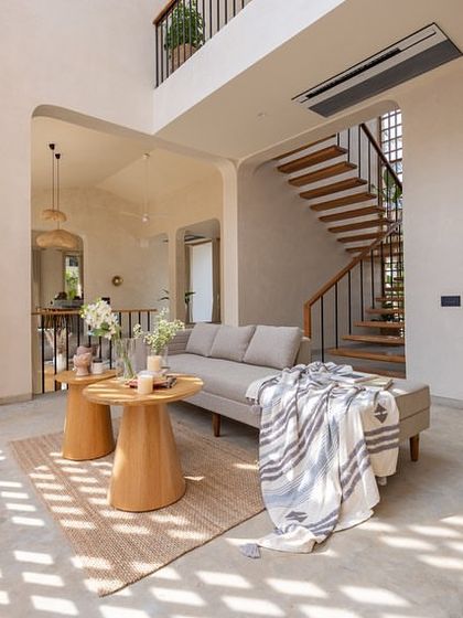 Light and shadow play across the plaster walls and concrete floors in the House of Basho. We carved out this indoor courtyard to allow the residents to enjoy the changing light throughout the day, enhancing the home's serene, retreat-like quality.