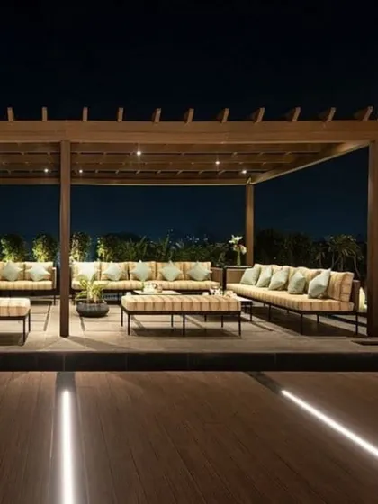 Our expertise extends to large-scale hospitality projects. Here, we designed and executed an expansive outdoor lounge for a hotel, featuring custom pergolas, durable outdoor furniture, and integrated lighting for a world-class guest experience.