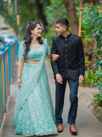 A candid walking shot of Diksha and Vighnesh during their engagement session. These natural, unposed moments often result in the most cherished photographs.