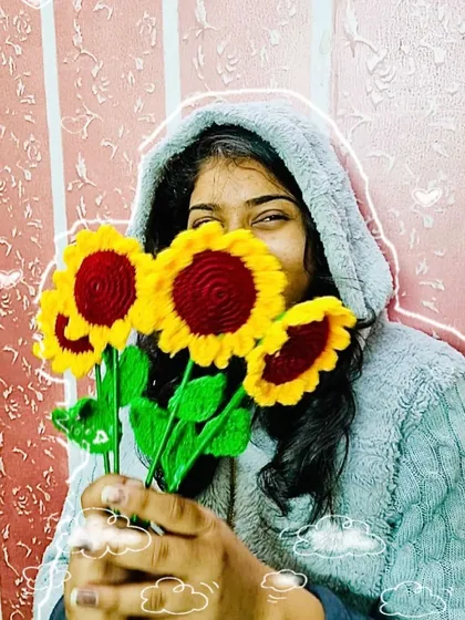 A happy moment with my creations. Holding a bunch of my crochet sunflowers, which always bring a smile to my face.