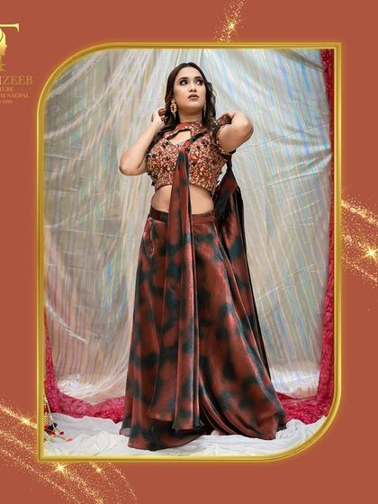 Embrace the festive spirit with our exquisite designer wear. This printed saree with a sequined blouse is a unique and stylish choice.
