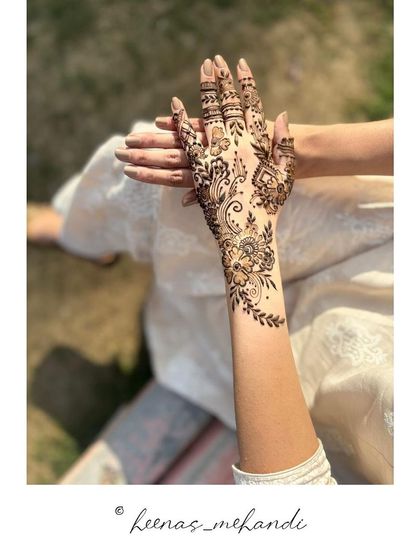A stunning Arabic-style henna design. The use of negative space and a combination of floral and paisley motifs makes this a very popular choice.