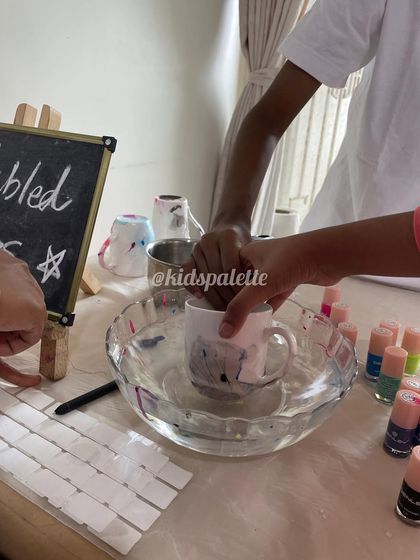 Getting ready for a colorful celebration with marbled mugs. This activity uses nail polish and water to create beautiful, unique patterns on ceramic mugs.
