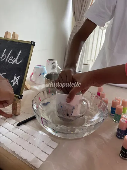 Getting ready for a colorful celebration with marbled mugs. This activity uses nail polish and water to create beautiful, unique patterns on ceramic mugs.
