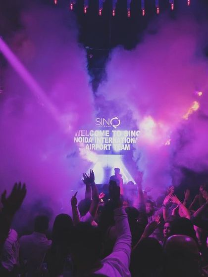 The mix of purple and orange lights with smoke at SinQ.