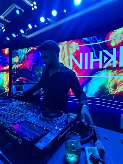 In the zone, surrounded by sound and light. This is my office. Here, I am focused on one thing: reading the room and playing the perfect track to elevate the moment.