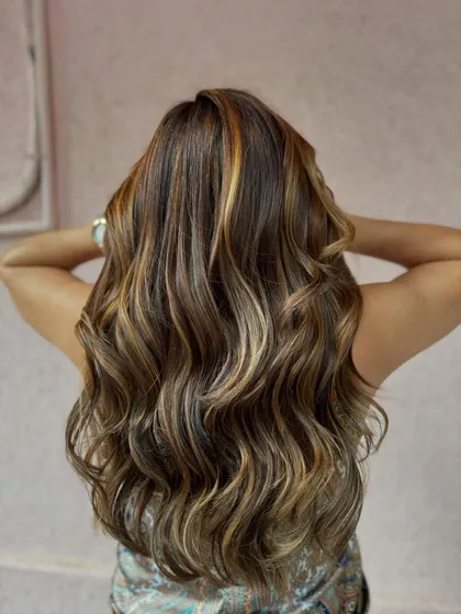 The back view of this non-bleach color correction. We created beautiful, flowing highlights that look natural and get rid of any old, unwanted color.