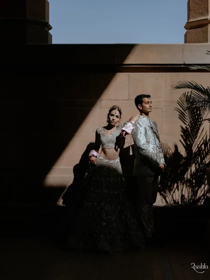 A play of light and shadow at Umaid Bhawan Palace. This artistic portrait of Amala and Aditya uses dramatic lighting to create a moody and powerful image.