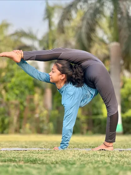 This is an advanced pose that combines a backbend with a split, requiring flexibility in the spine, shoulders, and hips. Try it.