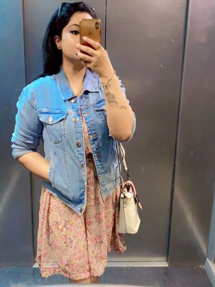 A floral dress with a denim jacket is a timeless combination for a casual, feminine look.