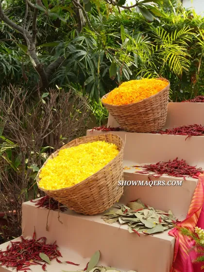 Baskets of fresh marigold petals and dried red chilies used as part of the authentic, sensory decor for the Banaras-themed event.