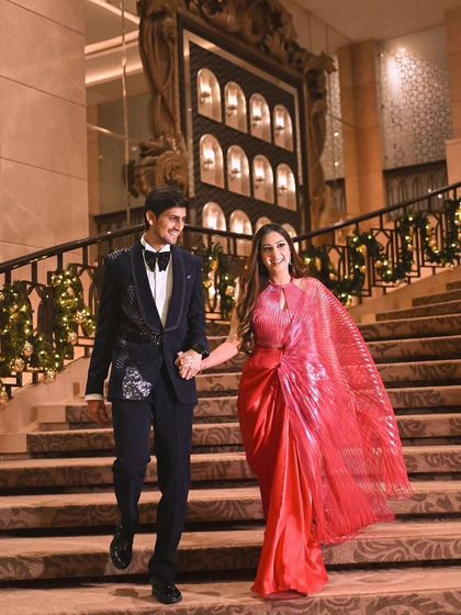 The couple making a grand entrance down the stairs.