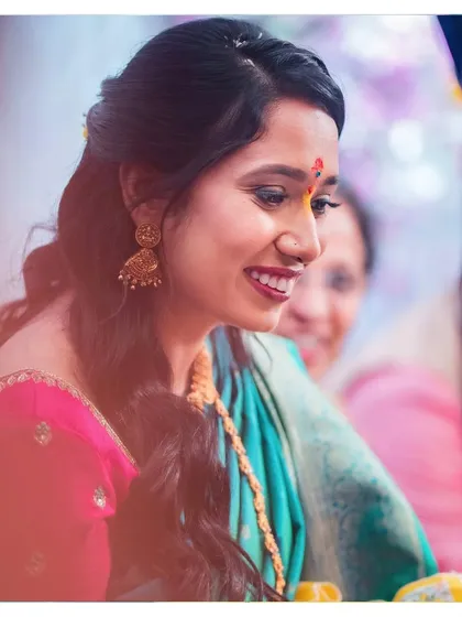 The ceremony glow. Shwetha's engagement look is all about radiance and happiness, with fresh makeup that enhances her beautiful smile.
