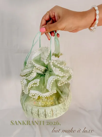 Sankranti, but make it luxe. This beautiful organza and pearl potli is an elegant and meaningful return gift for the harvest festival.