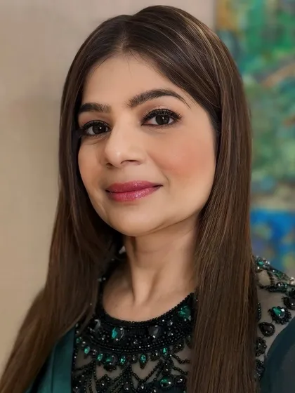 A closer portrait of our client, highlighting her smooth, sleek hair and perfectly blended makeup. This is a classic and timeless look for any formal occasion.