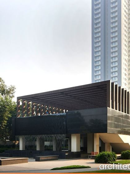 The clubhouse at EMAAR Digital Homes in Gurgaon is designed as a modern pavilion set within a lush landscape. The cascading water feature at the entrance creates a dramatic and welcoming arrival experience for residents and guests.