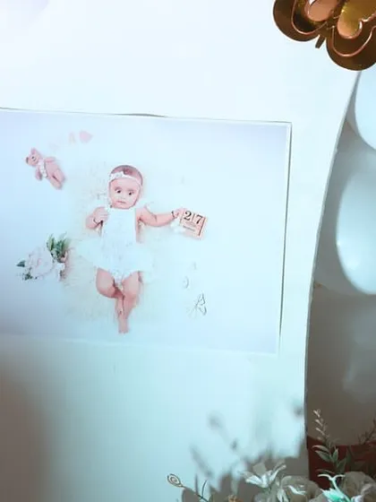 I love incorporating personal touches, like this beautiful photo of the birthday girl, displayed as part of the decor to celebrate her first year.
