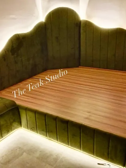 This custom corner bed is one of my favourite creations. Upholstered in a rich olive green velvet with a scalloped, channel-tufted headboard and integrated LED backlighting, it creates an incredibly cozy and inviting atmosphere.